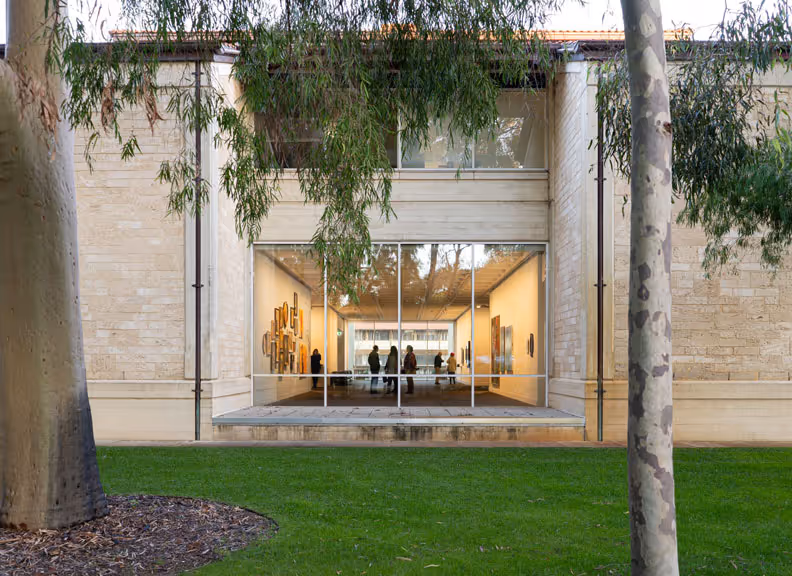 Lawrence Wilson, an outdoor courtyard with an open-air garden surrounded by stone walls