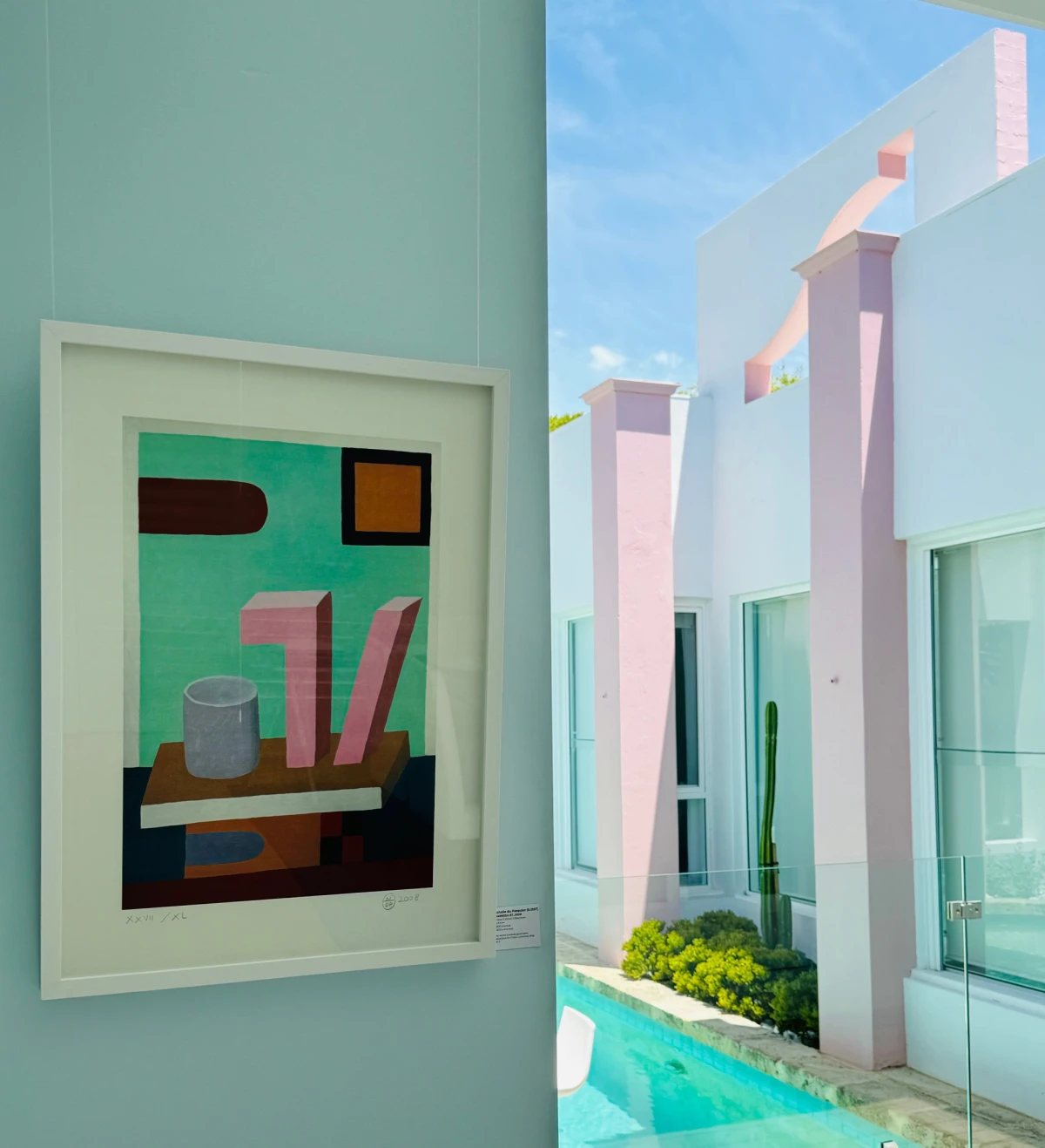 OFFMARKET GALLERY, a building with a pastel pink section and a bright artwork visible in the entrance