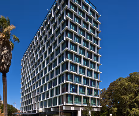 Council House, a tall, multi-story building with a modern, gridded facade