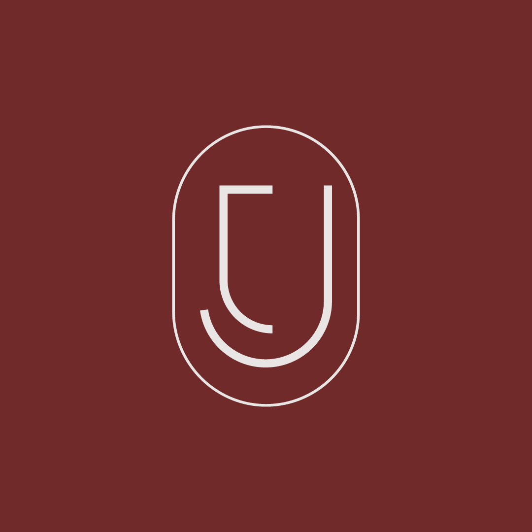 Logo minimalista da marca Josiane Tobias Advocacia, formada por um T e um J dentro de uma forma oval.