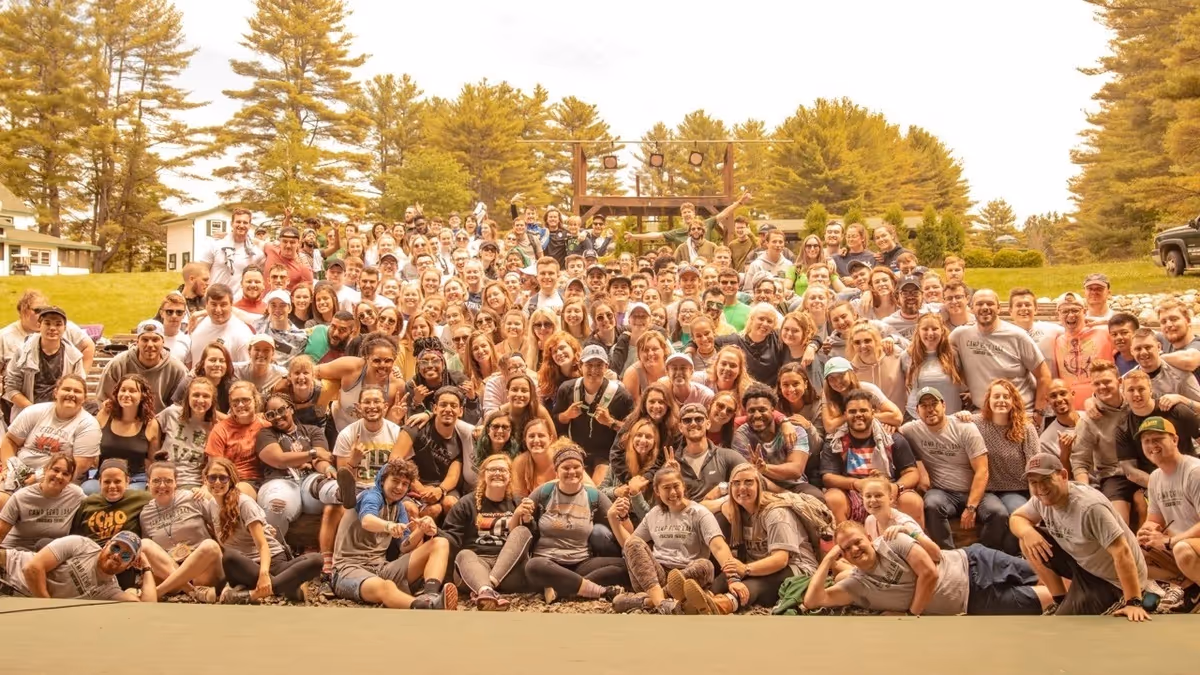 A group of camp staff posing for a group photo at summer camp.