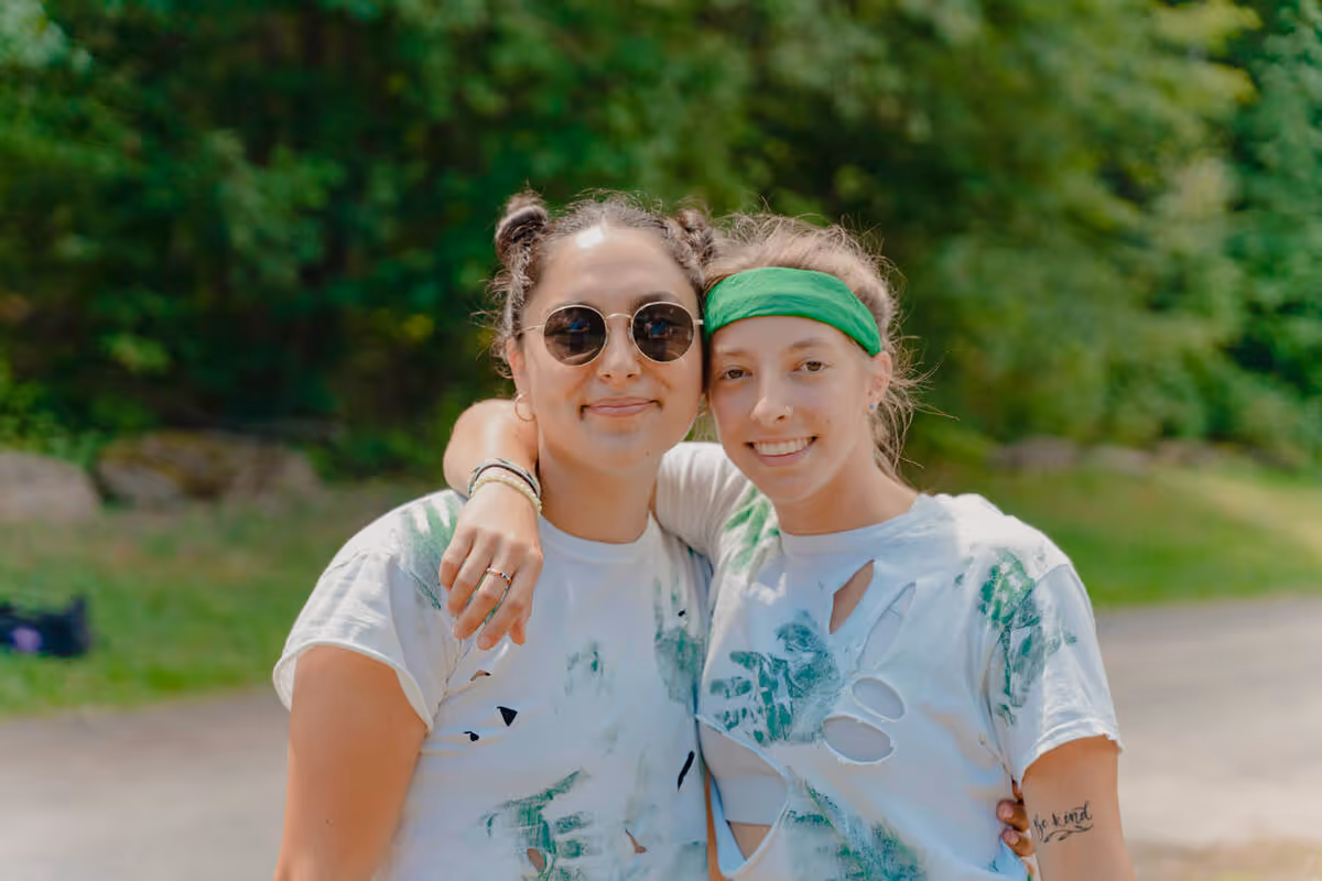 Two staff friends at summer camp.