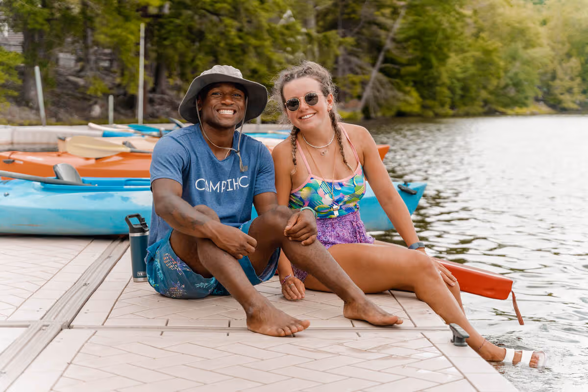 Two friends laughing at summer camp.