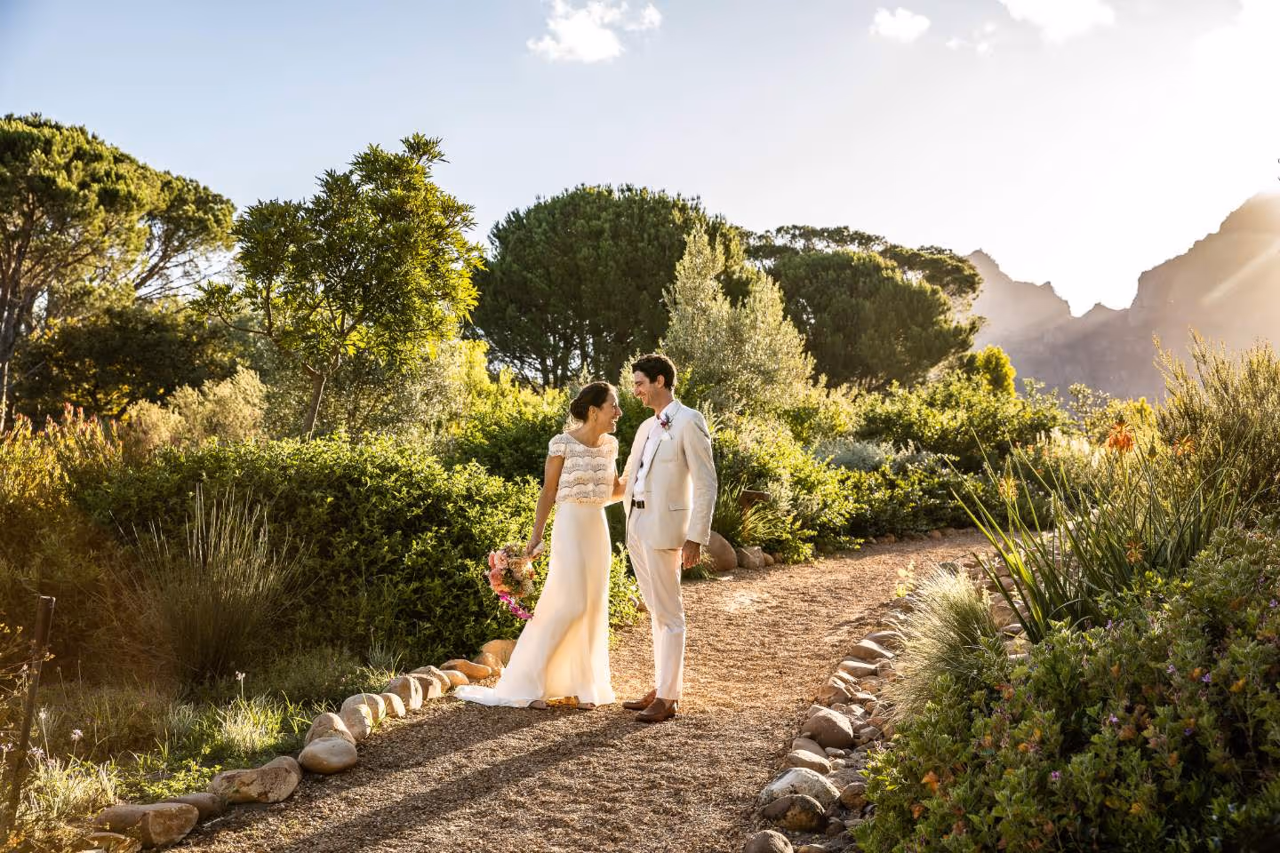 A couple walk together at their white Wedding in the Cape Winelands, South Africa