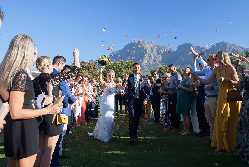 South African wedding couple walk down the aisle