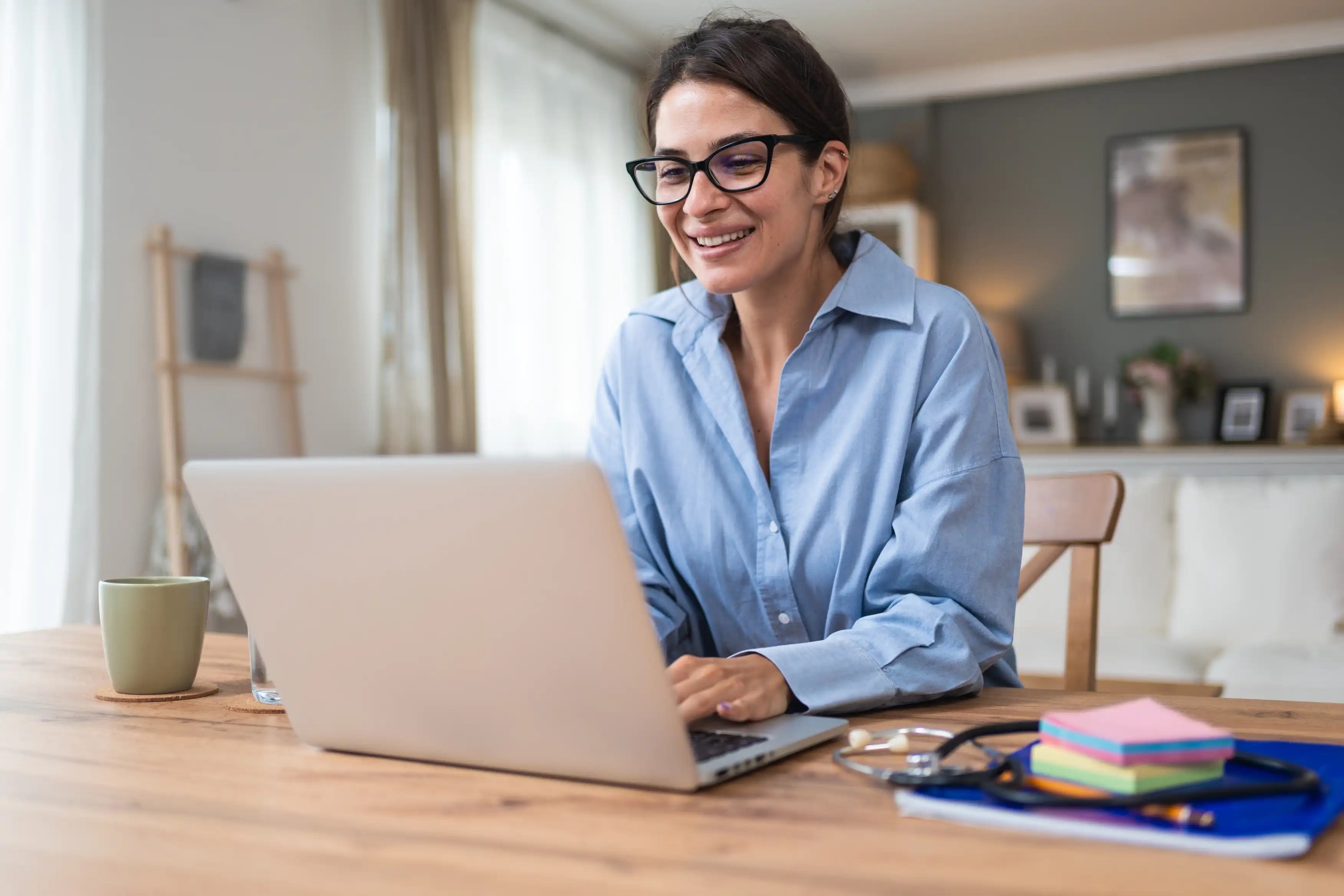 Telemedicine. Young woman doctor working at home office, private general practitioner, healthcare and medical female worker using laptop computer for contact with senior patients Helping people online