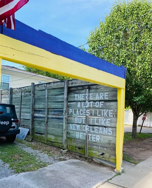 a Bob Dylan quote stenciled on a garage wall