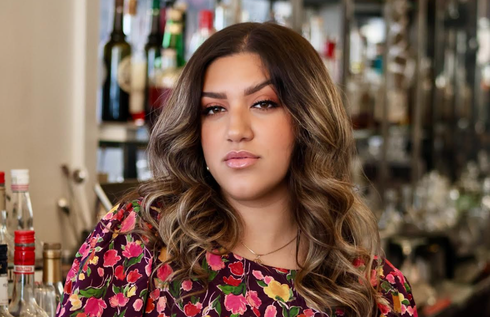 Abigail Gullo behind the bar