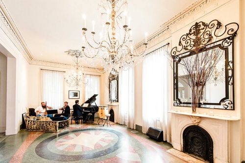 musicians playing in a large, elegant room