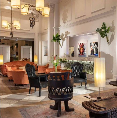 elegant hotel lobby with different chairs, sofa, and decor