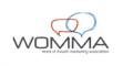 WOMMA logo with stylized interlocking letters W and M in light blue and pink above the text.