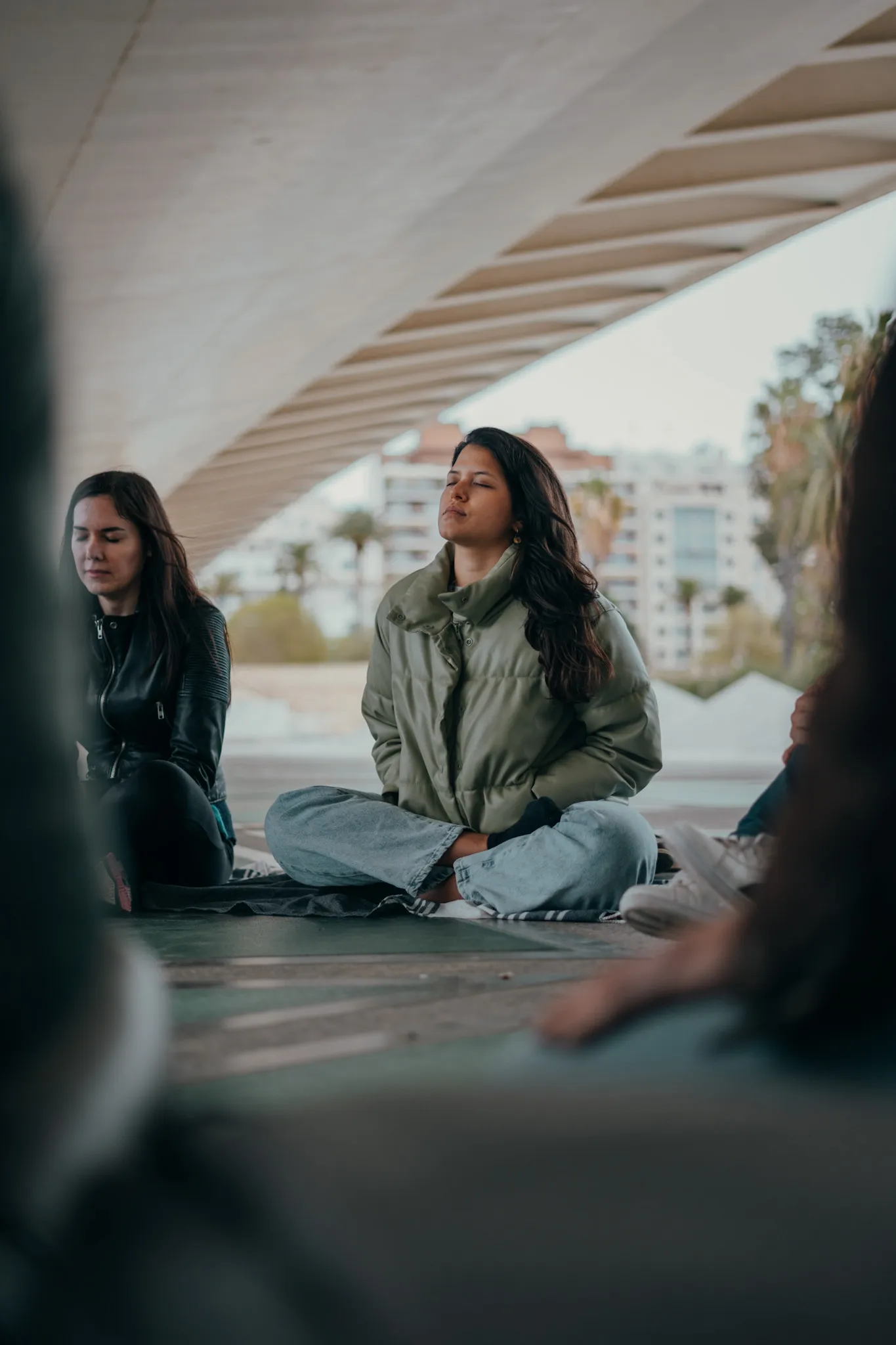 Woman meditating during one of Elevate Sphere's events, in Valencia, Spain
