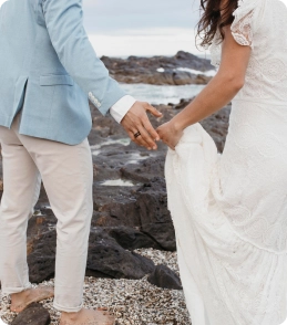 "Newlyweds walking along the beach 