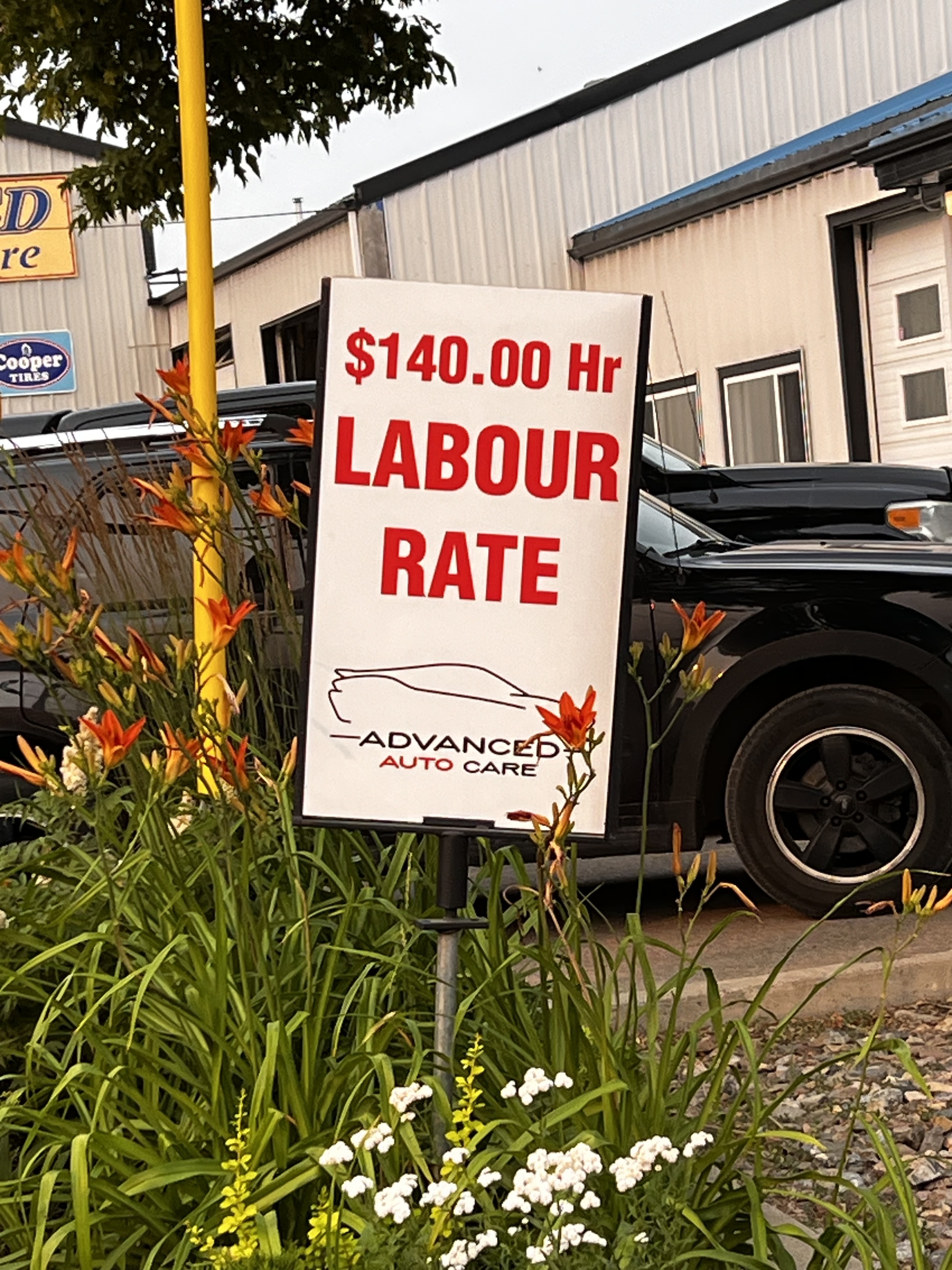 labour rate 140 per hour sign