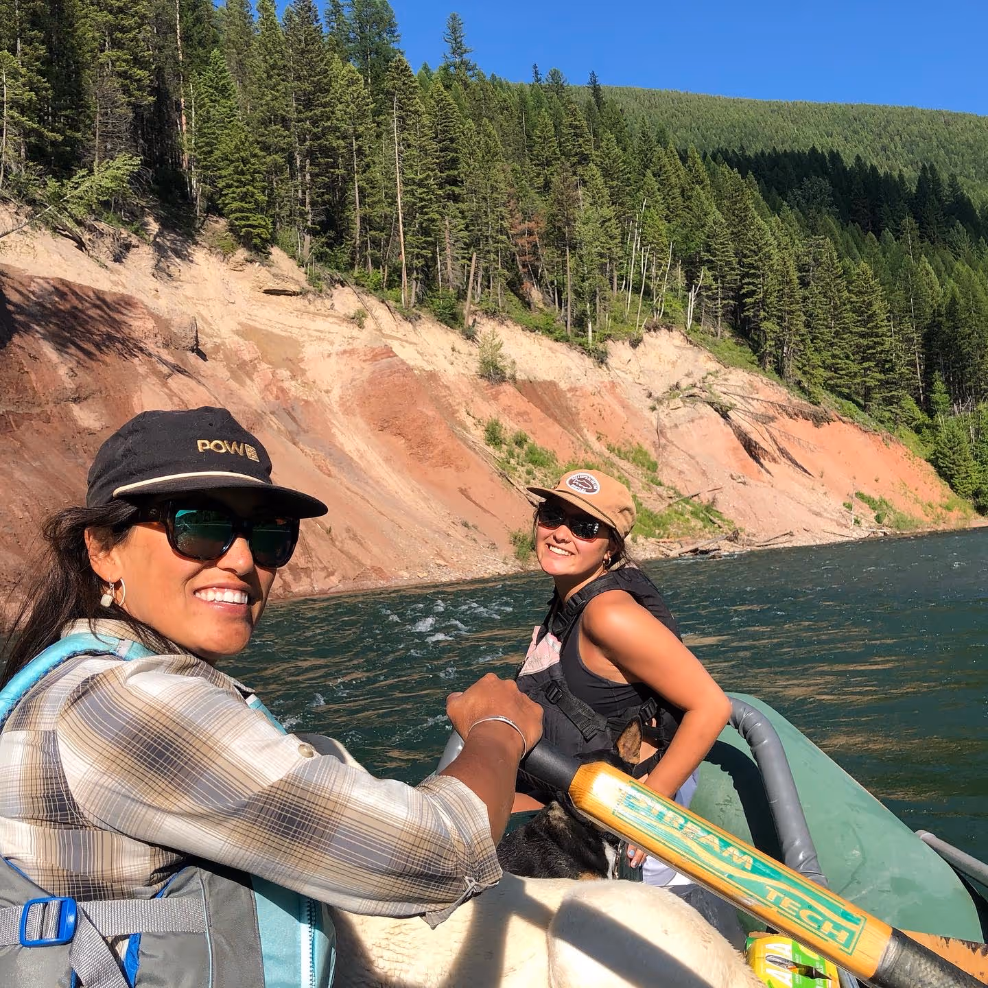 women on fly fishing raft on river
