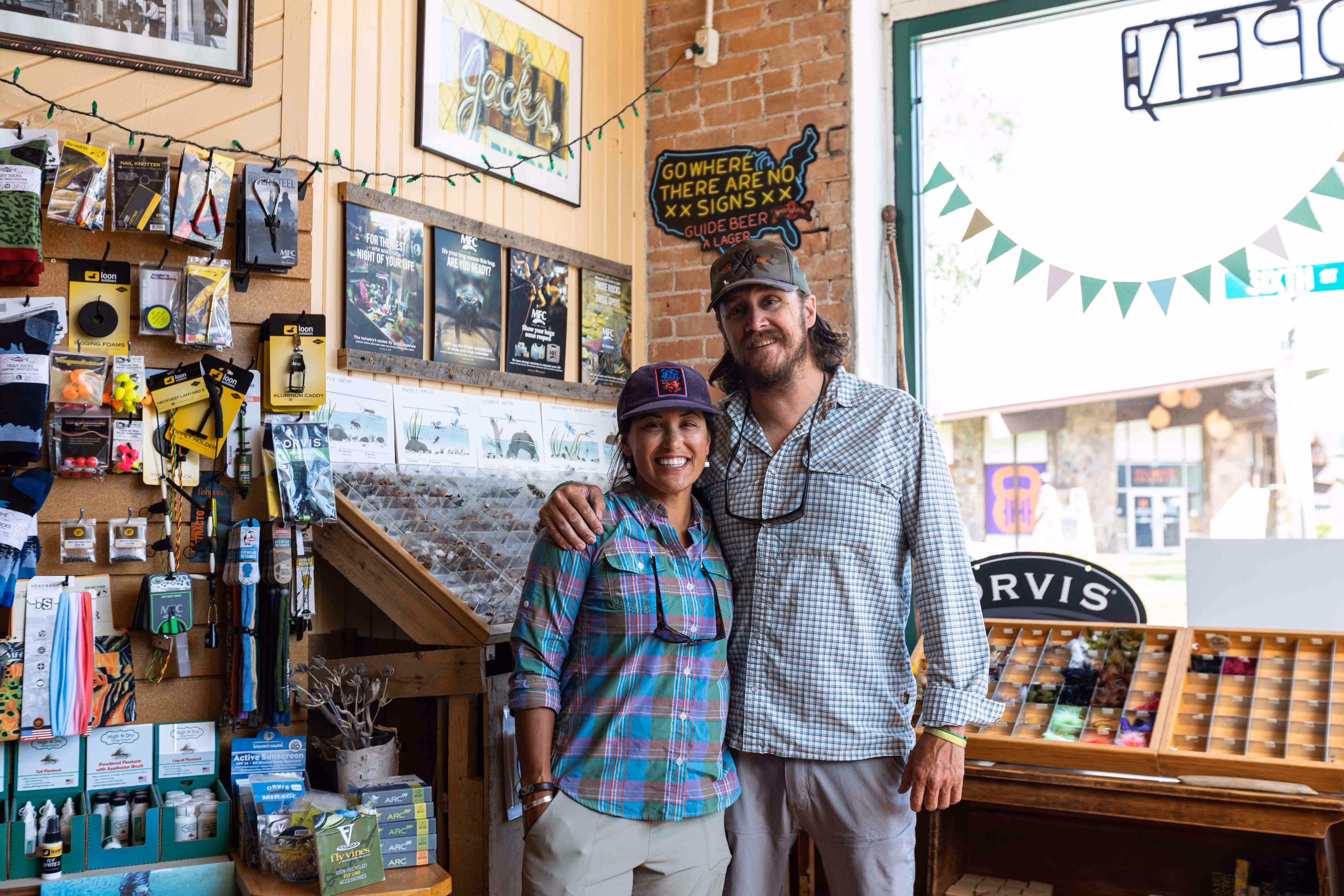 man and woman standing in lary's fly shop