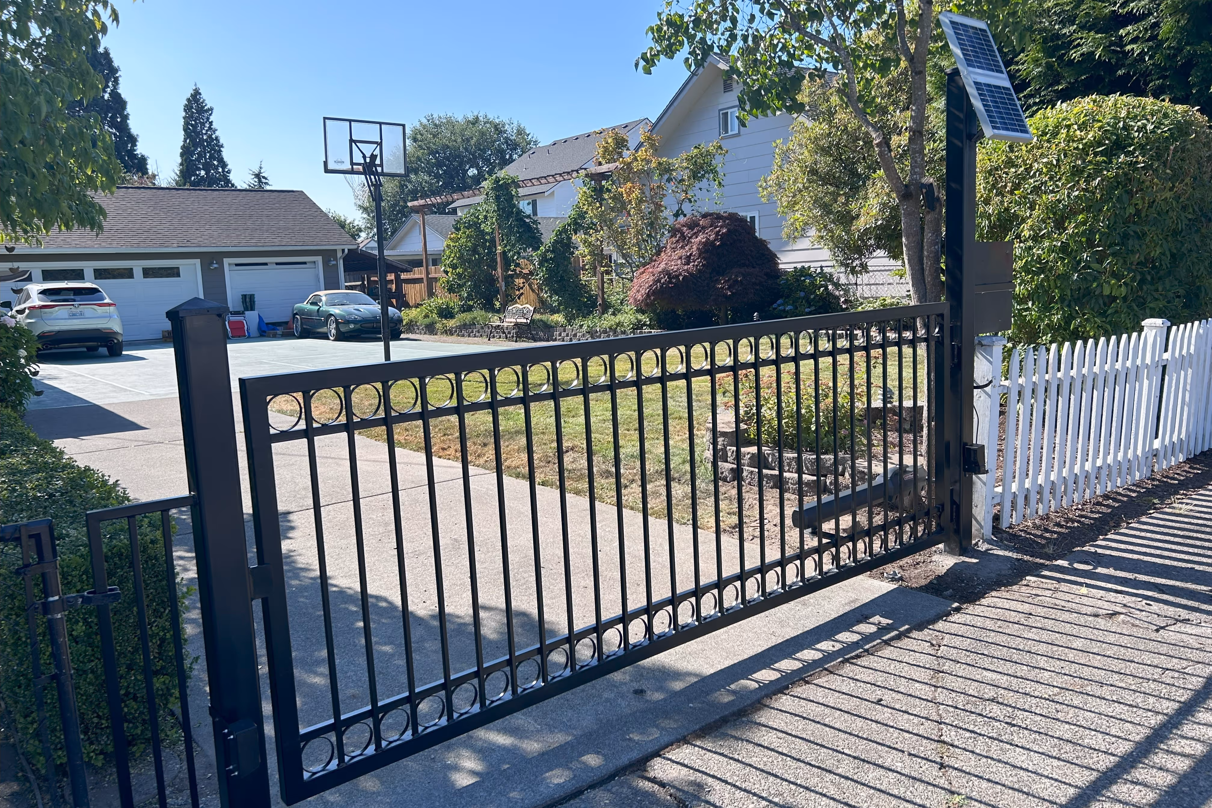 solar based decorated Swing Iron Driveway Gate in Puyallup, WA