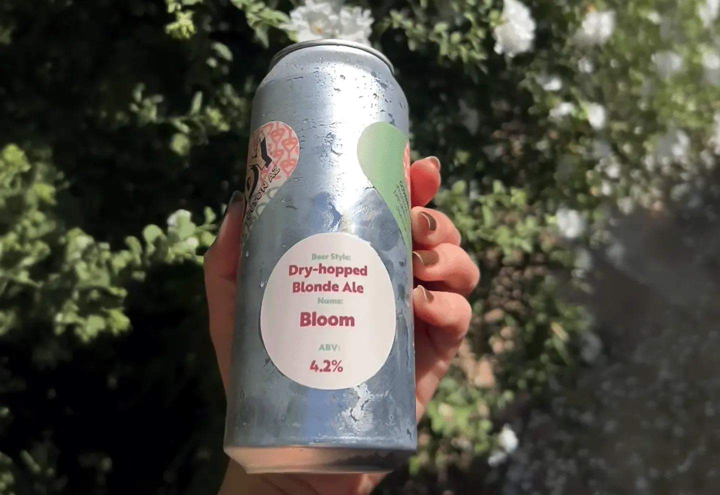 hand holding small small batch beer can