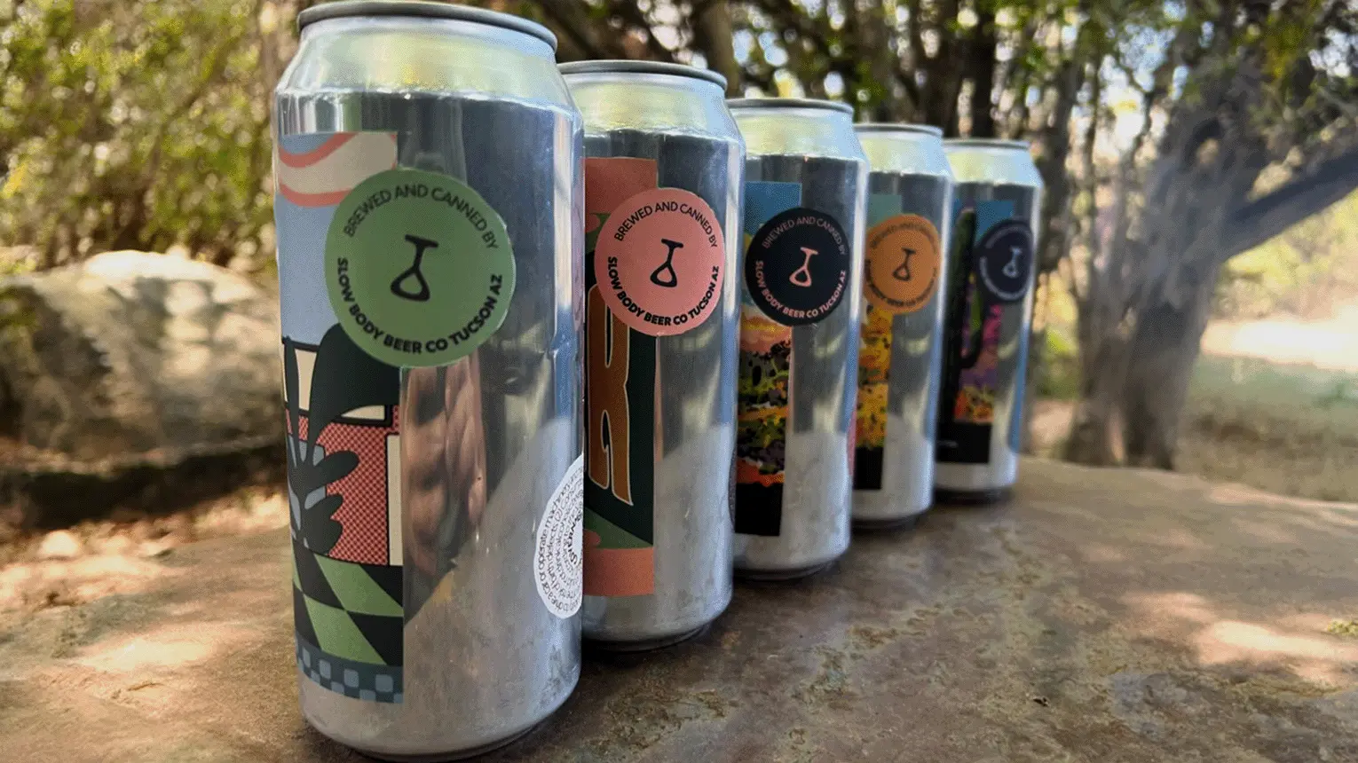 16 oz cans lined up outside on table