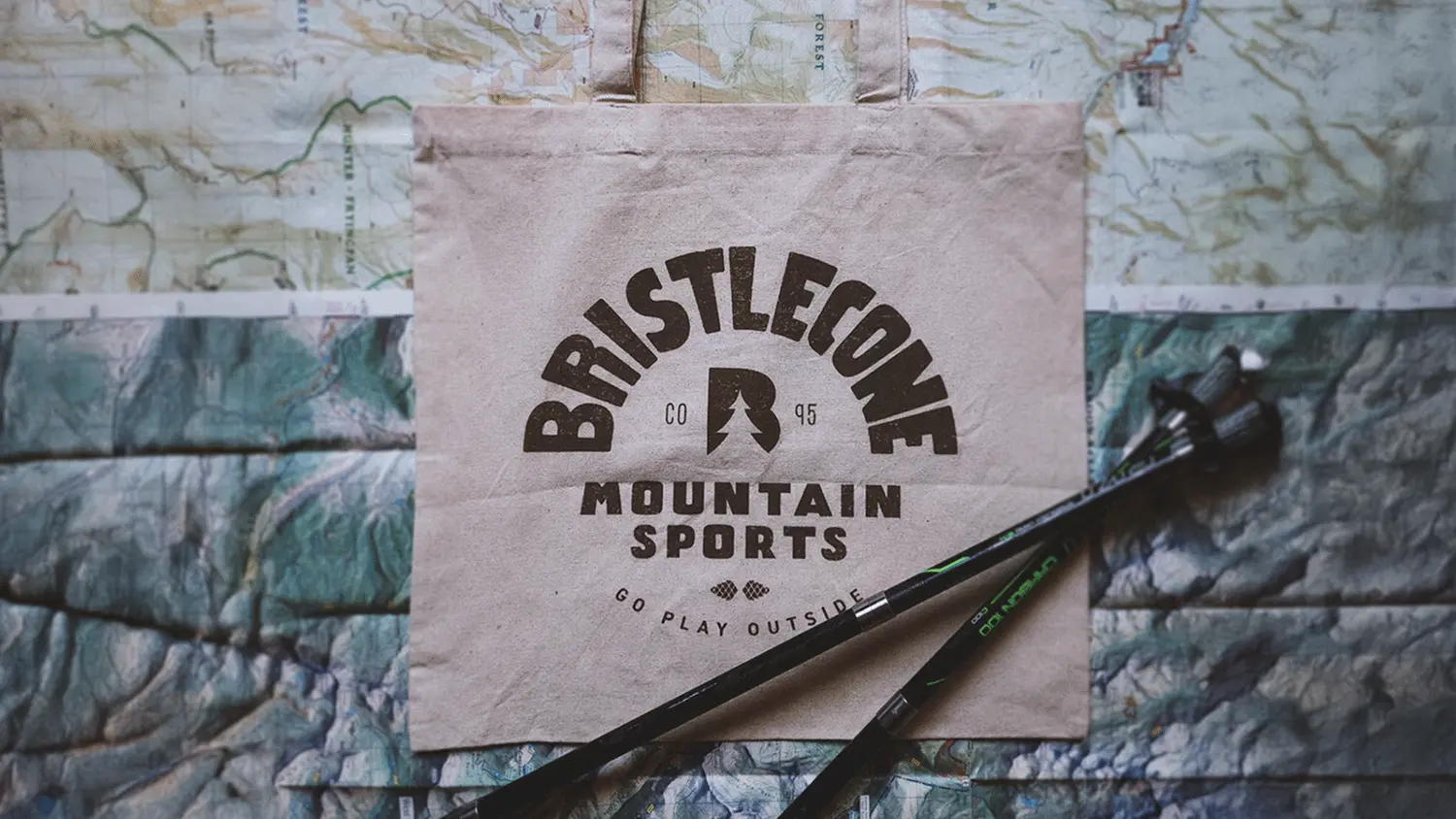 branded canvas bag on map