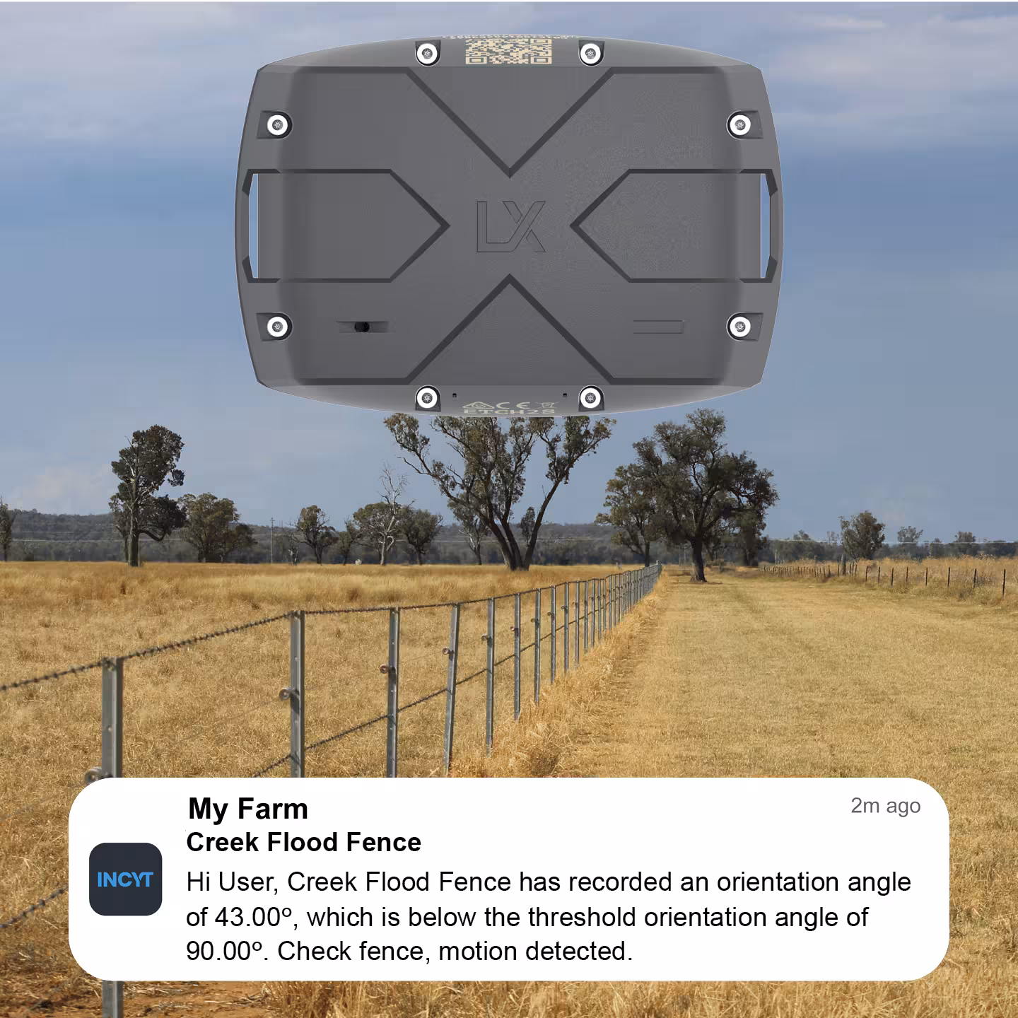 Rural fence in dry grassland with a black device above and a notification about fence motion detected.