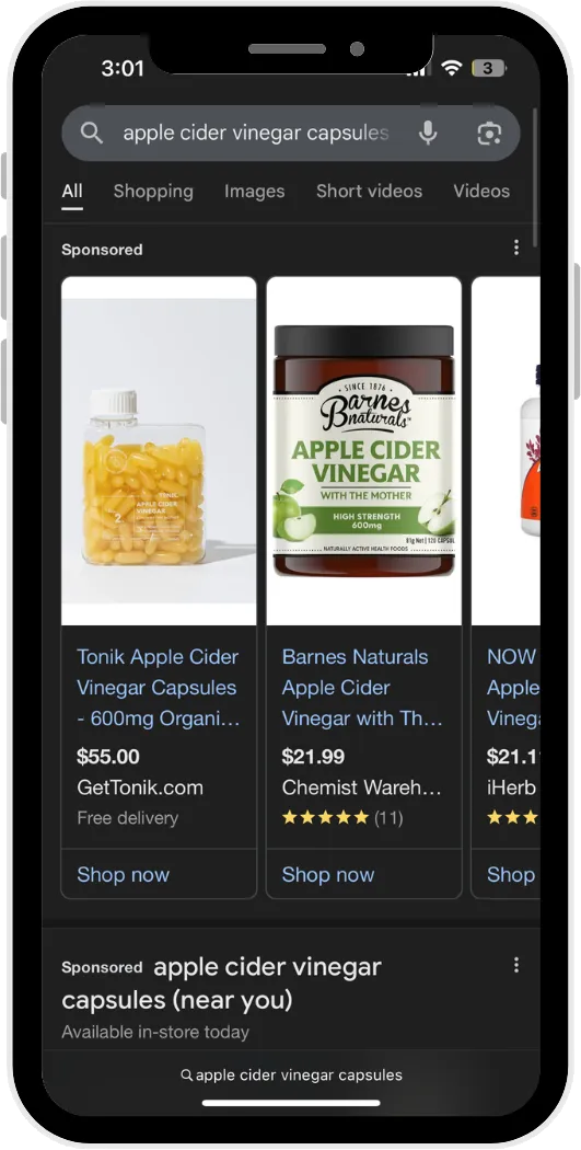 Smartphone screen showing search results for apple cider vinegar capsules with product ads and prices.