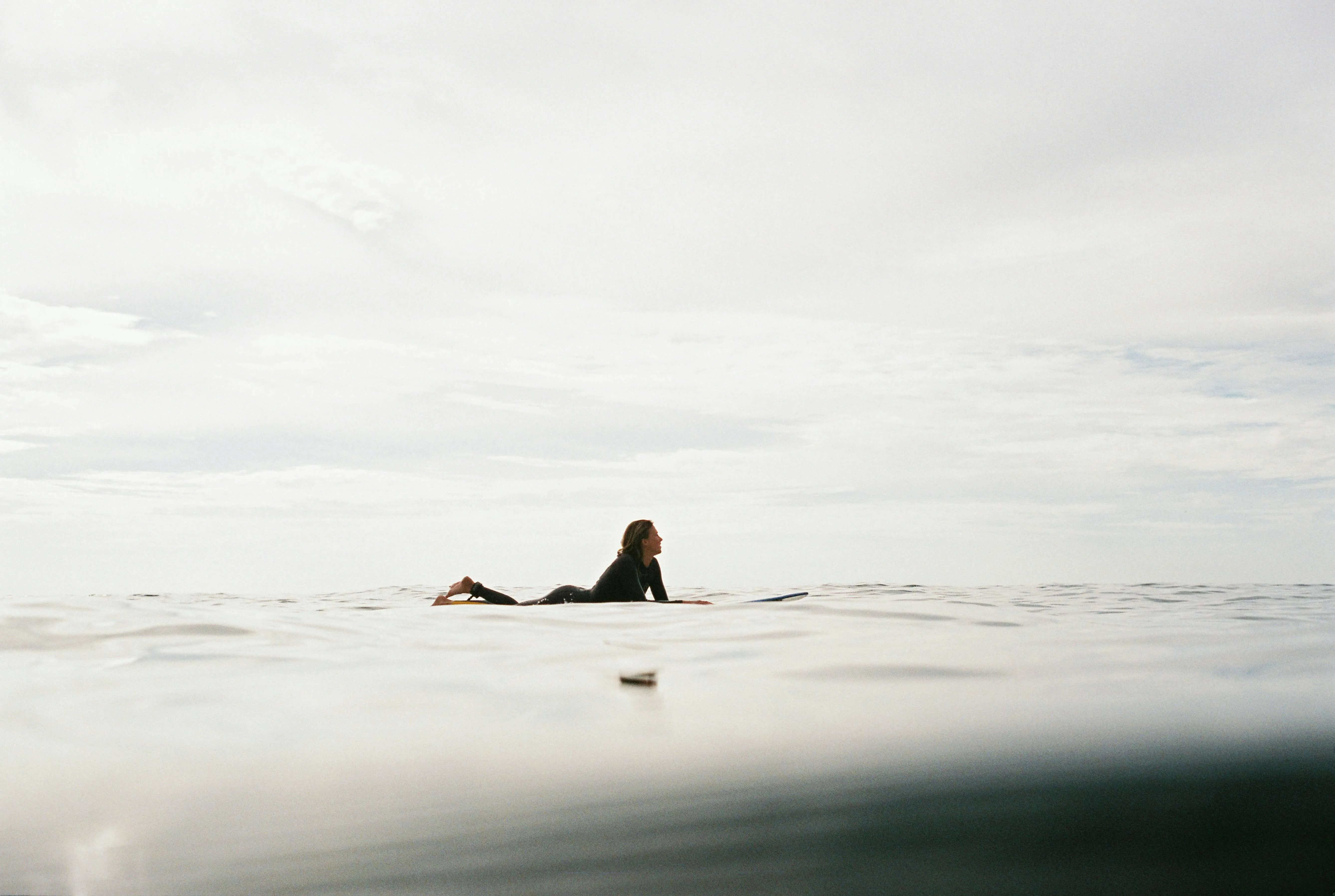 Surfer waiting in the ocean