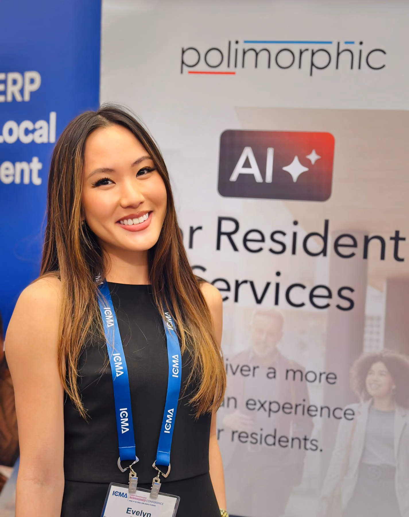 Smiling woman wearing a black dress and blue ICMA lanyard stands in front of a Polimorphic AI banner.