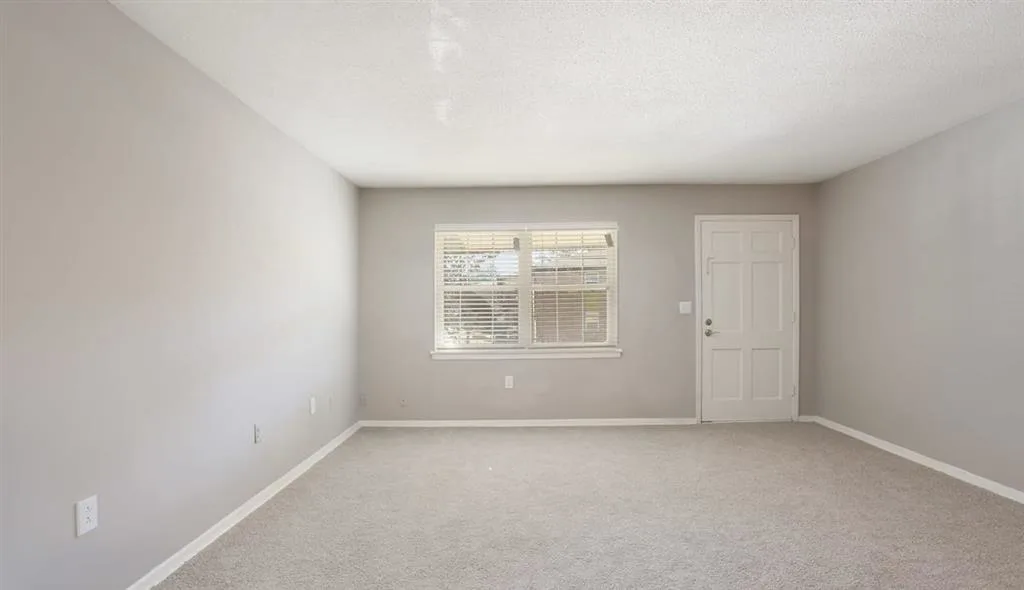 Empty closeted room with open windows