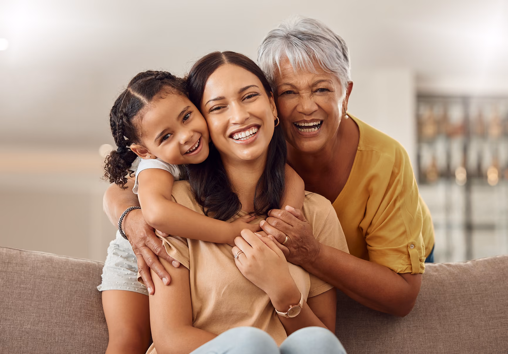 Grandmother, mom and child hugging and enjoying quality time together