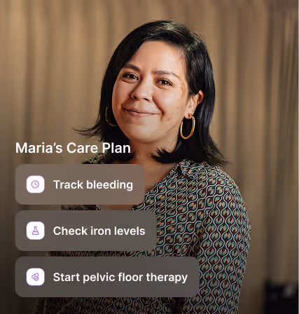 Video call screen showing a smiling woman wearing peach shirt with a smaller window of another smiling woman.