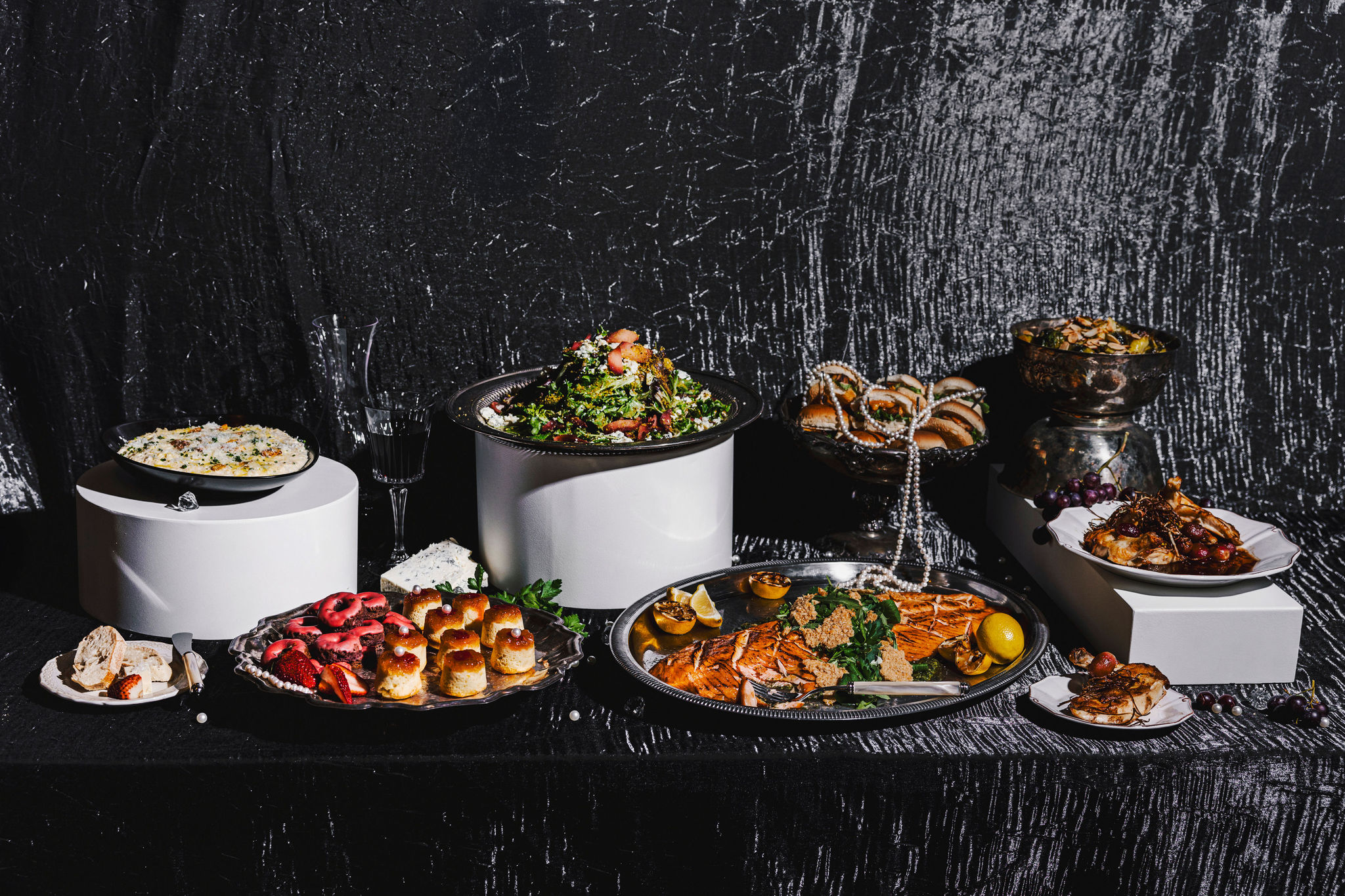 Holiday buffet table designed by Tuxedos & Tennis Shoes Catering, a DSquared Hospitality Company located in Seattle, WA