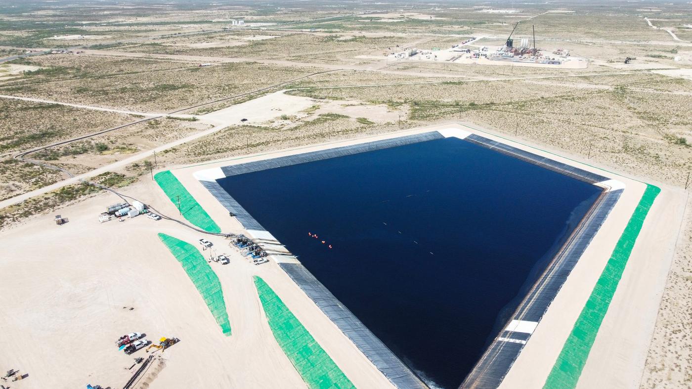 Aerial view of a lined produced water pit in the Permian Basin