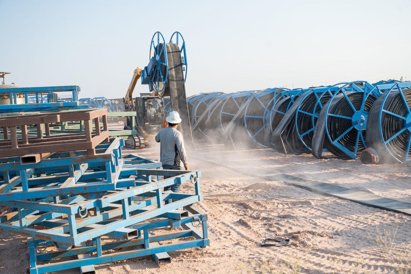 Rows of layflat hose reels staged in the Flowpoint yard