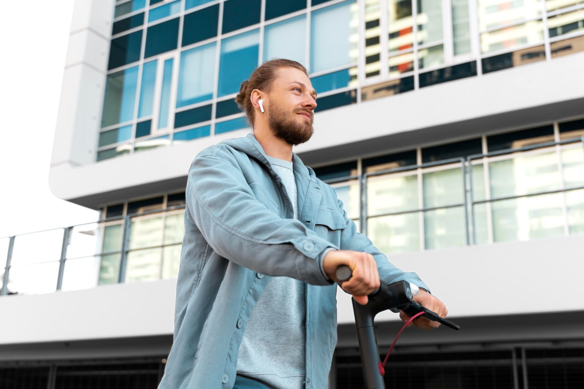 A person rides an electric scooter outside in an urban setting, symbolizing independence, mobility, and the ability to maintain daily responsibilities while pursuing flexible outpatient addiction treatment and recovery support