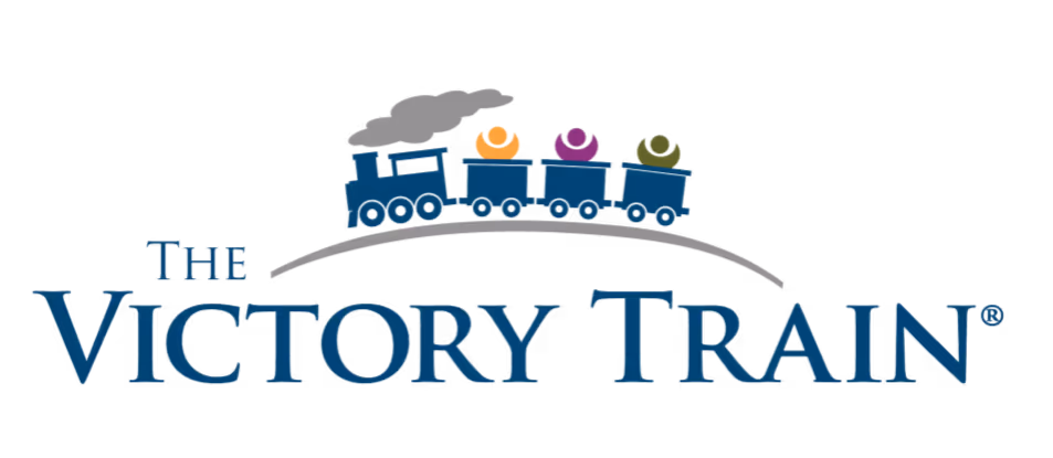 Logo of The Victory Train featuring a blue steam locomotive pulling three train cars with colorful hats on top above the text.