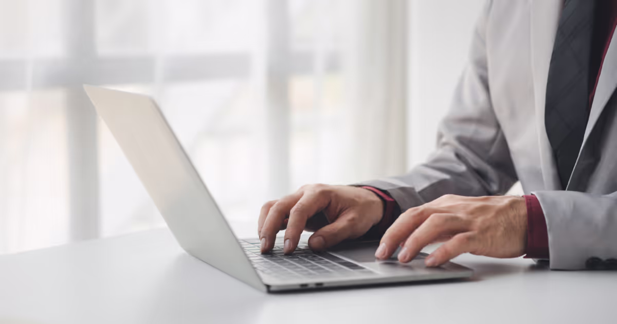 Person typing on a laptop
