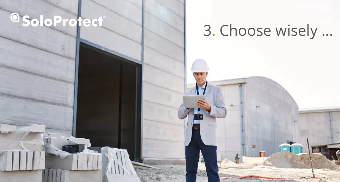 Worker with hard hat surveying project