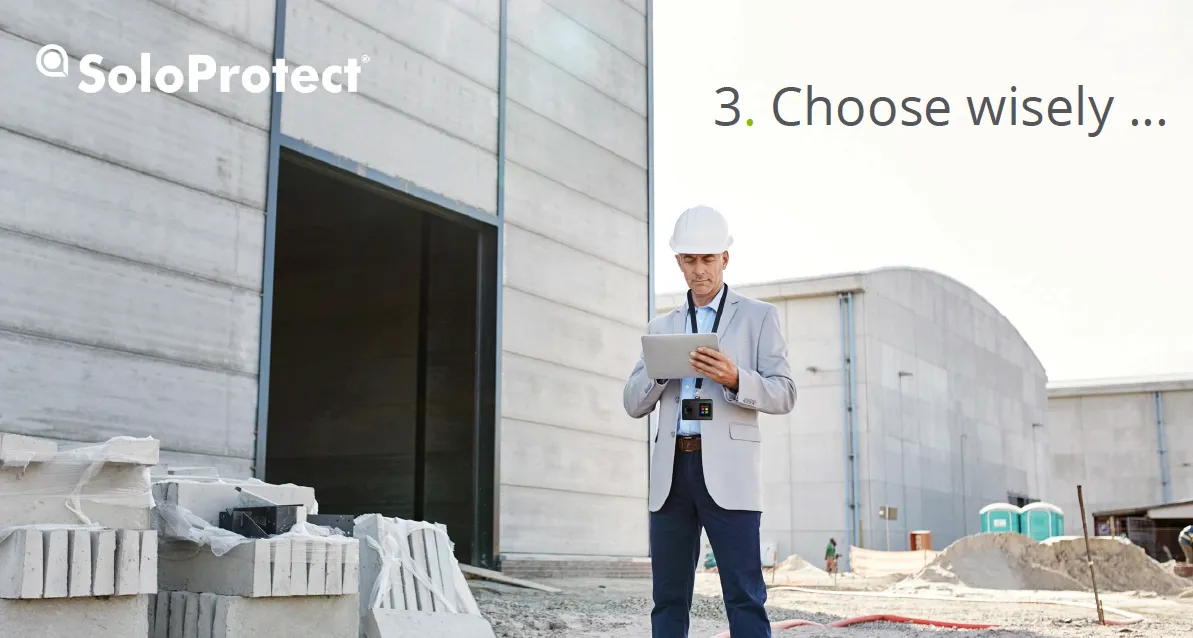 Worker with hard hat surveying project