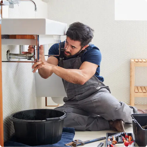 A lone maintenance worker threatened with a hammer