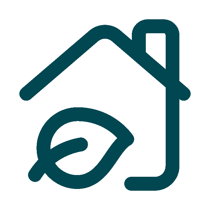 Haus mit einem Blatt, das ökologische oder nachhaltige Wohnkonzepte symbolisiert.