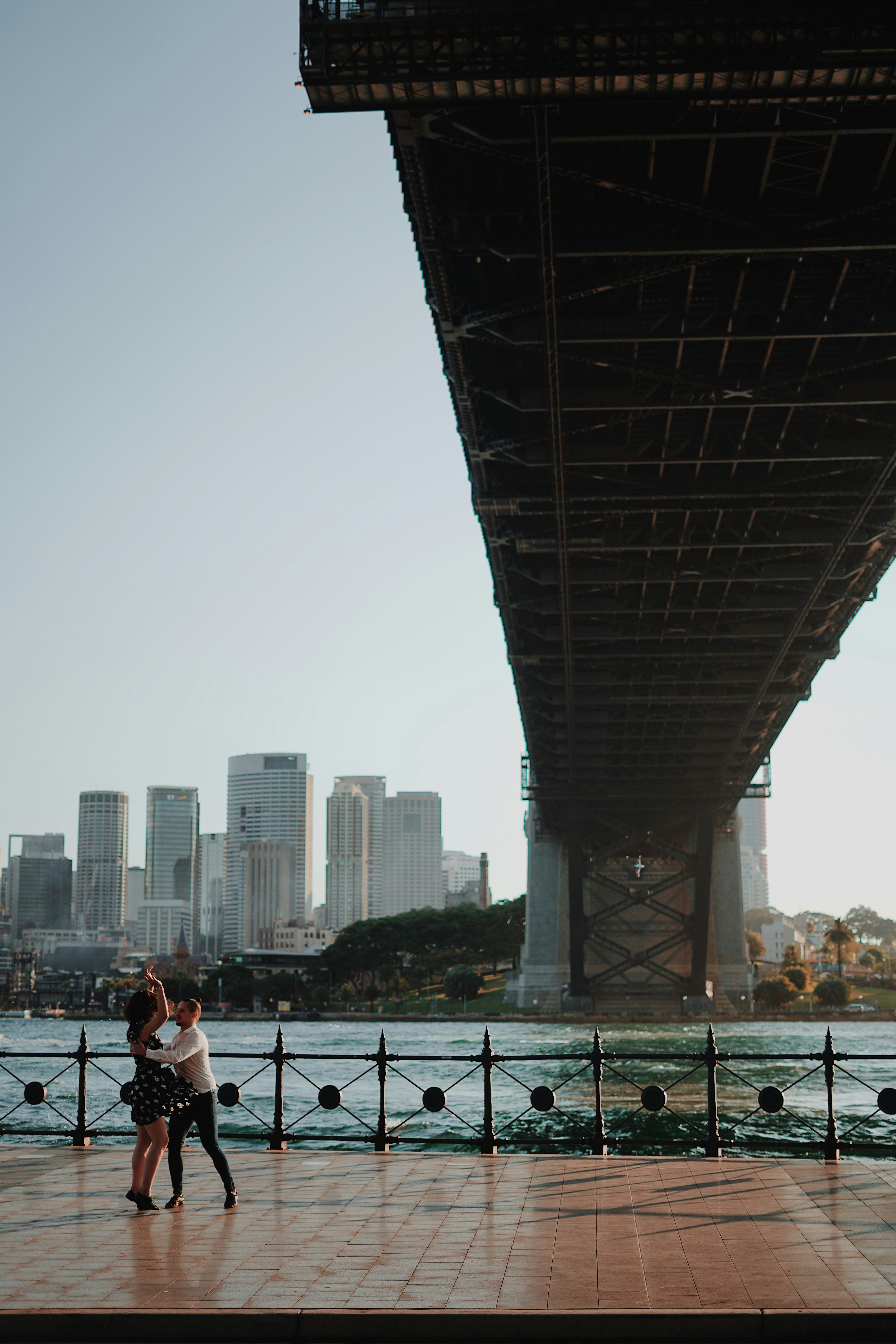 Casual couple getting married under the Sydney Harbour Bridge