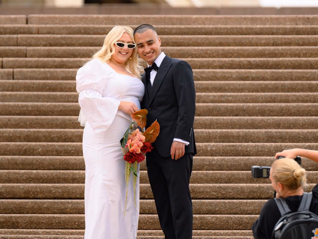 Couple on the stairs of the Opera House