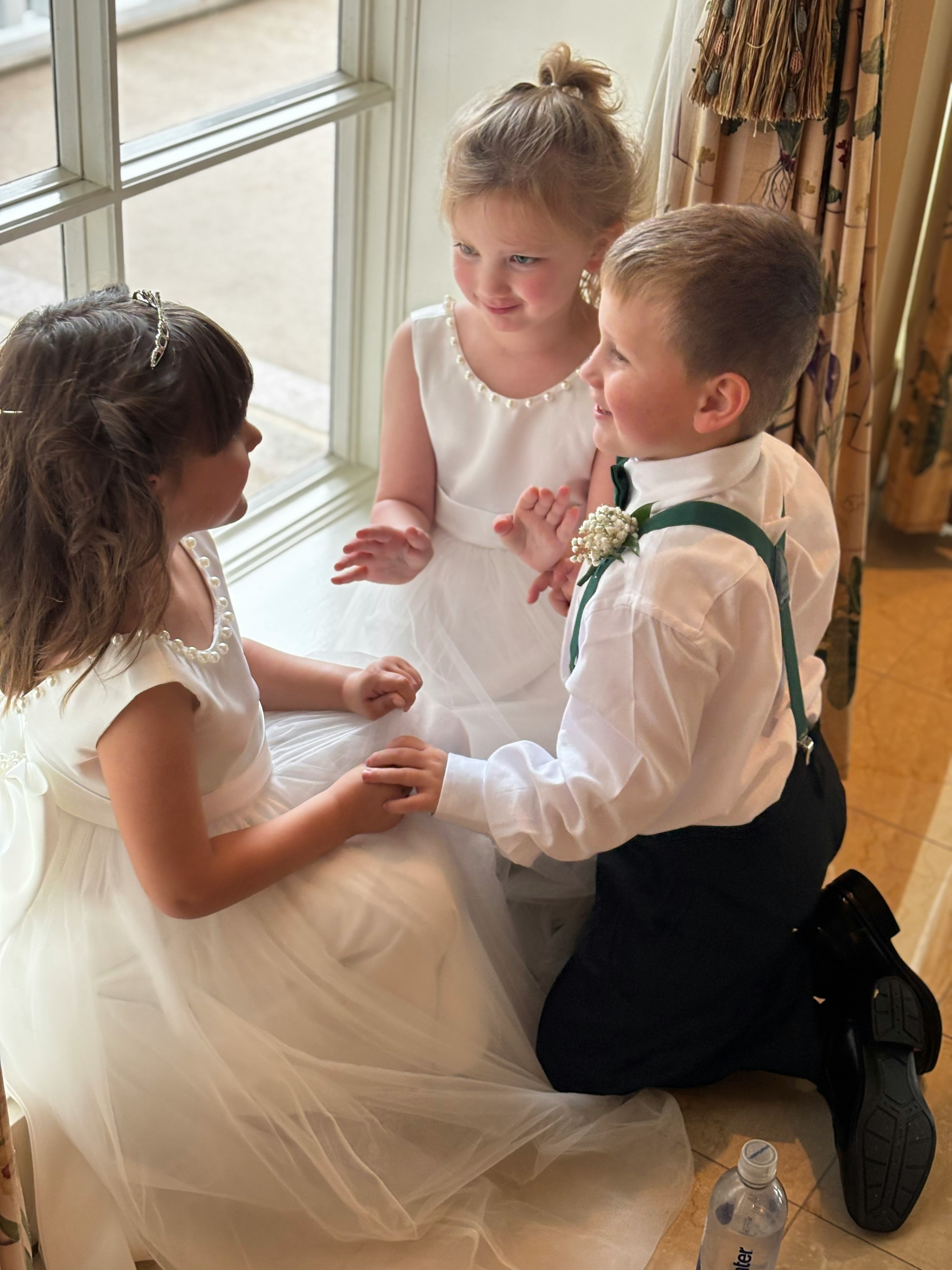 # children at a wedding playing