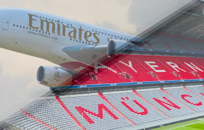 Emirates airplane flying over Allianz Arena, home stadium of FC Bayern Munich, highlighting global sports sponsorship and partnership between Emirates airline and Bayern Munich FC.