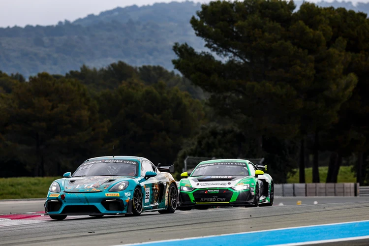 Two race cars competing on track with visible sponsor logos, representing F1 sponsors in motorsports.