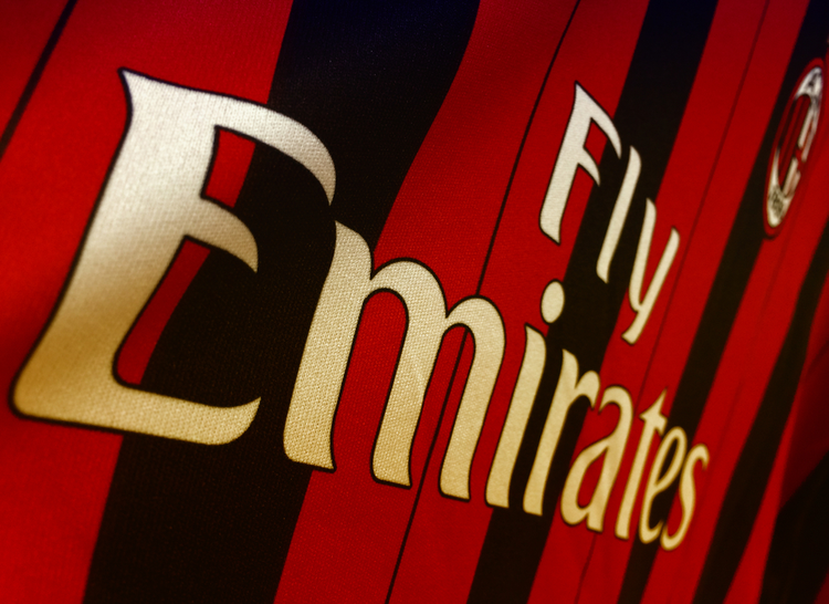 AC Milan jersey featuring Fly Emirates logo showcasing iconic Sports Sponsorship in football.