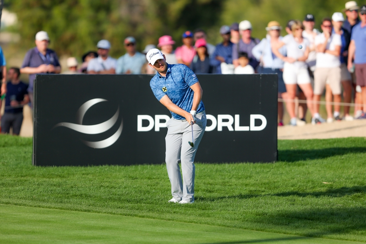 Professional golfer in action at the DP World Tour, showcasing DP World’s global sports marketing sponsorship in front of an engaged audience.