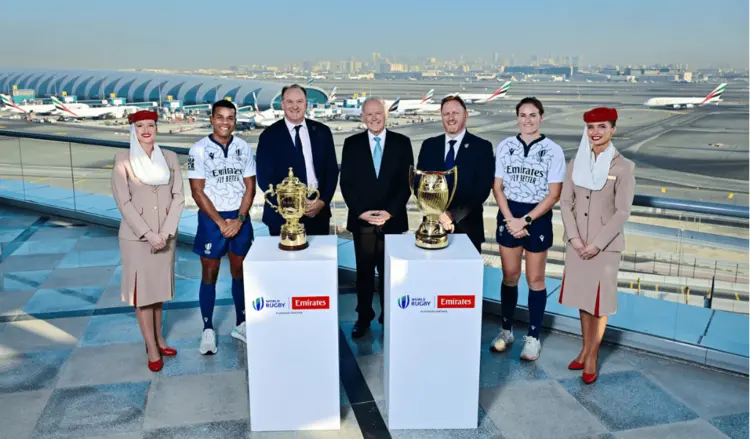 Emirates World Rugby event sponsorship photo with trophies, match officials, and Emirates cabin crew at Dubai Airport showcasing airline sports partnership branding