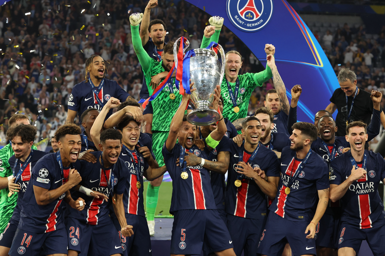 PSG players celebrating Champions League victory, highlighting sports marketing triumph in PSG Beyond sponsorship with trophy lift and Qatar Airways kit.